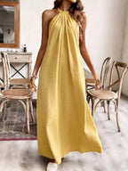 Elegant black halter neck maxi dress from Shopimist with flowing fabric and a stylish design for formal occasions.