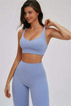 Fitglutes Activewear Kinetic Cross Back Sports Bra and Leggings 2-piece set, shown on a model in a workout pose.