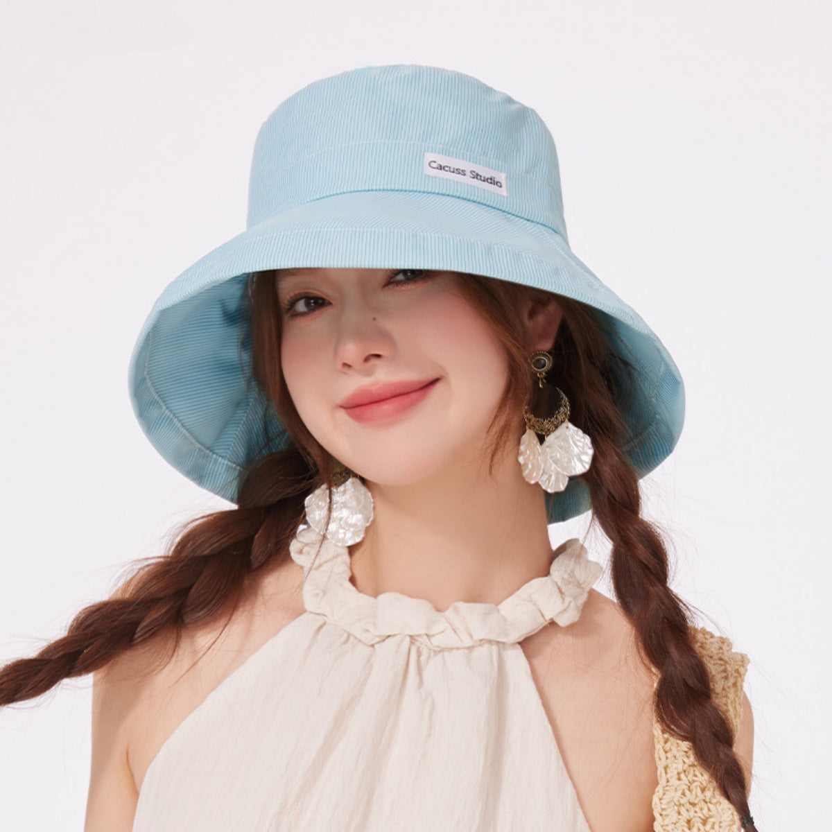Wide brim straw sun hat by Trendsi, perfect for summer beach vacations, featuring a stylish and elegant design.