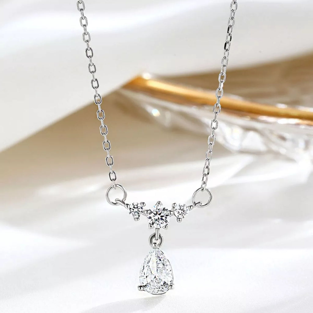 Sterling silver zircon teardrop necklace with a delicate chain, showcasing a sparkling teardrop pendant on a white background.