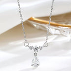 Sterling silver zircon teardrop necklace with a delicate chain, showcasing a sparkling teardrop pendant on a white background.