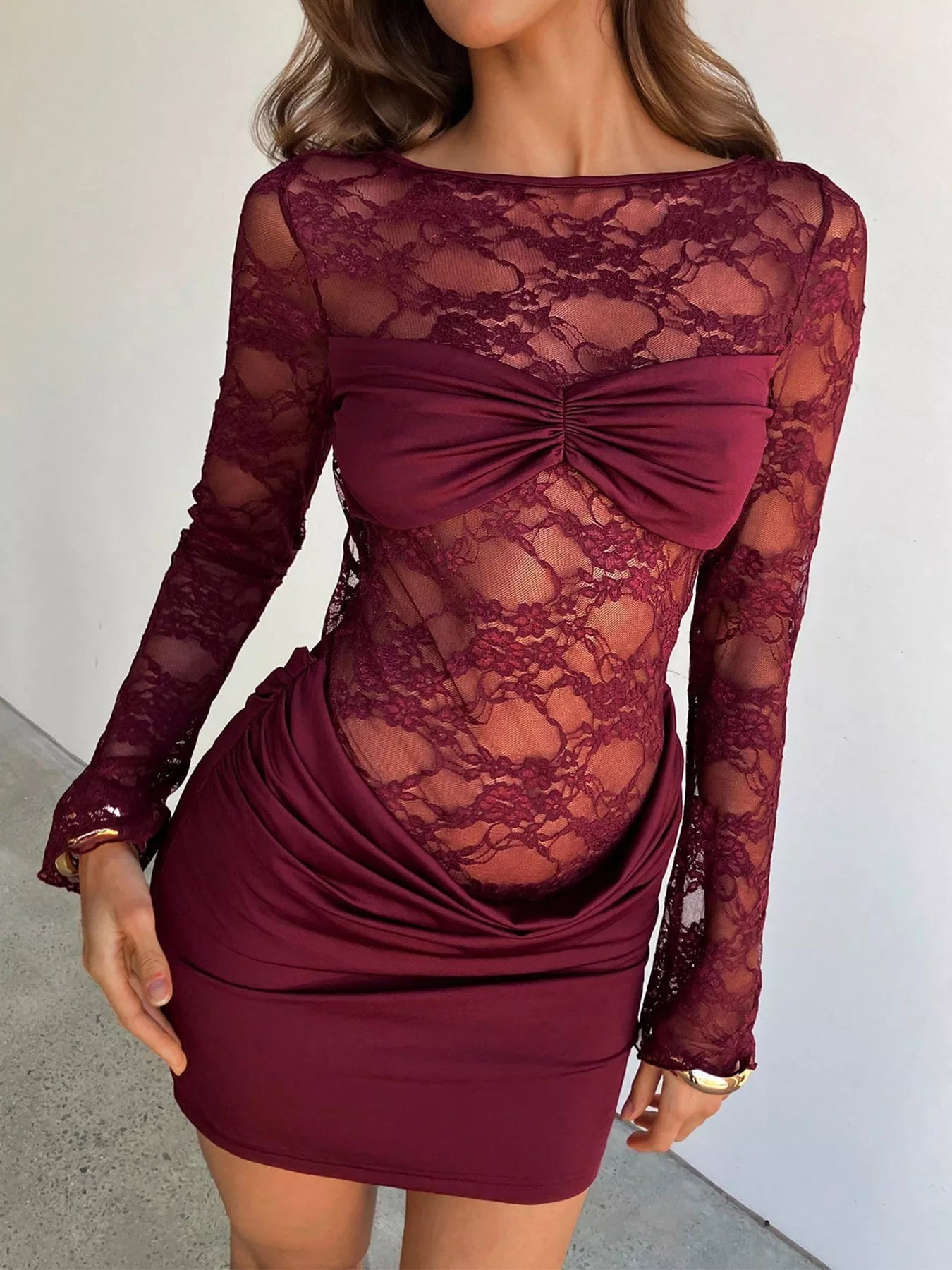 Lace sheer cutout back long sleeve ruched dress from Plush Fashion Hub, featuring elegant design with fitted silhouette.