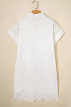 Solid color eyelet embroidered T-shirt mini dress by Trendsi featuring eyelet details and a casual, comfortable fit.
