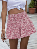 Floral print elastic waist shorts from Trendsi featuring a vibrant, colorful floral pattern and comfortable fit.