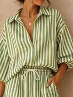 Plus size striped puff sleeve shirt and wide-leg drawstring pants set from Trendsi, featuring a stylish, comfortable matching outfit.