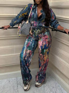 Artistic painted long sleeve denim shirt by Plush Fashion Hub featuring colorful, creative artwork on a classic denim design.