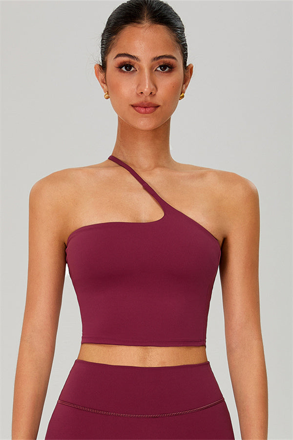 Fitglutes activewear two-piece crop top and shorts set, one-shoulder design, perfect for gym and workout sessions.