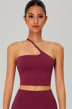 Fitglutes activewear two-piece crop top and shorts set, one-shoulder design, perfect for gym and workout sessions.