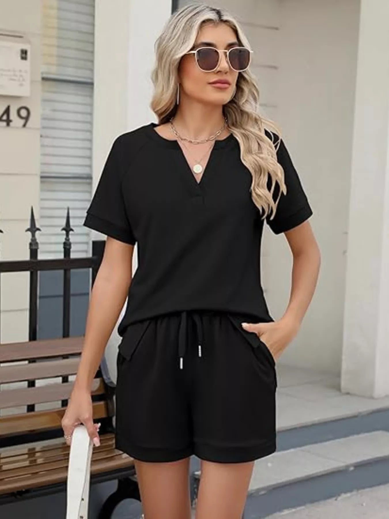 Solid color short sleeve top and shorts two-piece set by Trendsi, casual summer outfit, lightweight fabric, relaxed fit.
