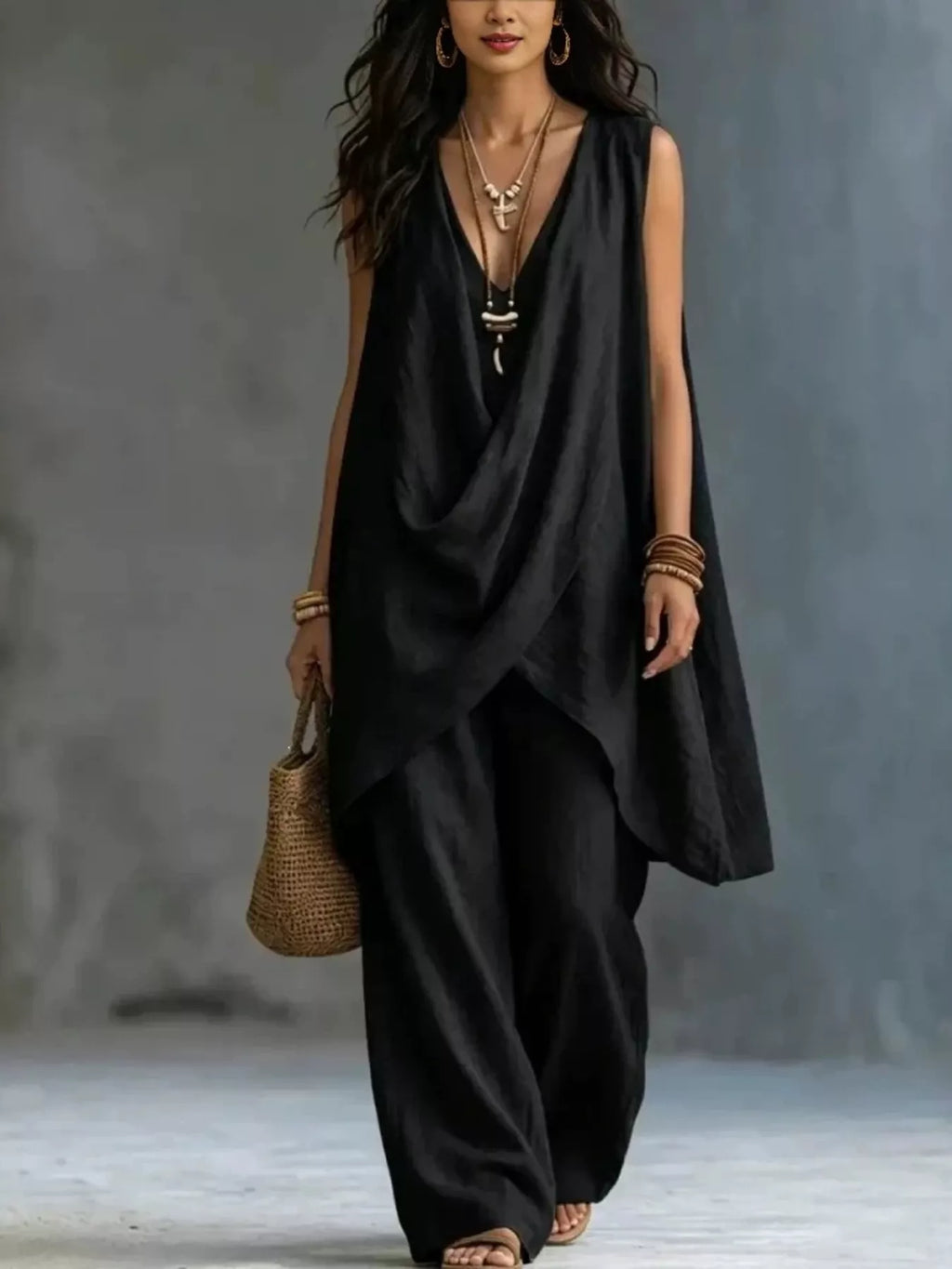 Plush Fashion Hub sleeveless asymmetrical top with wide-leg pants set, featuring stylish modern design and comfortable fit.