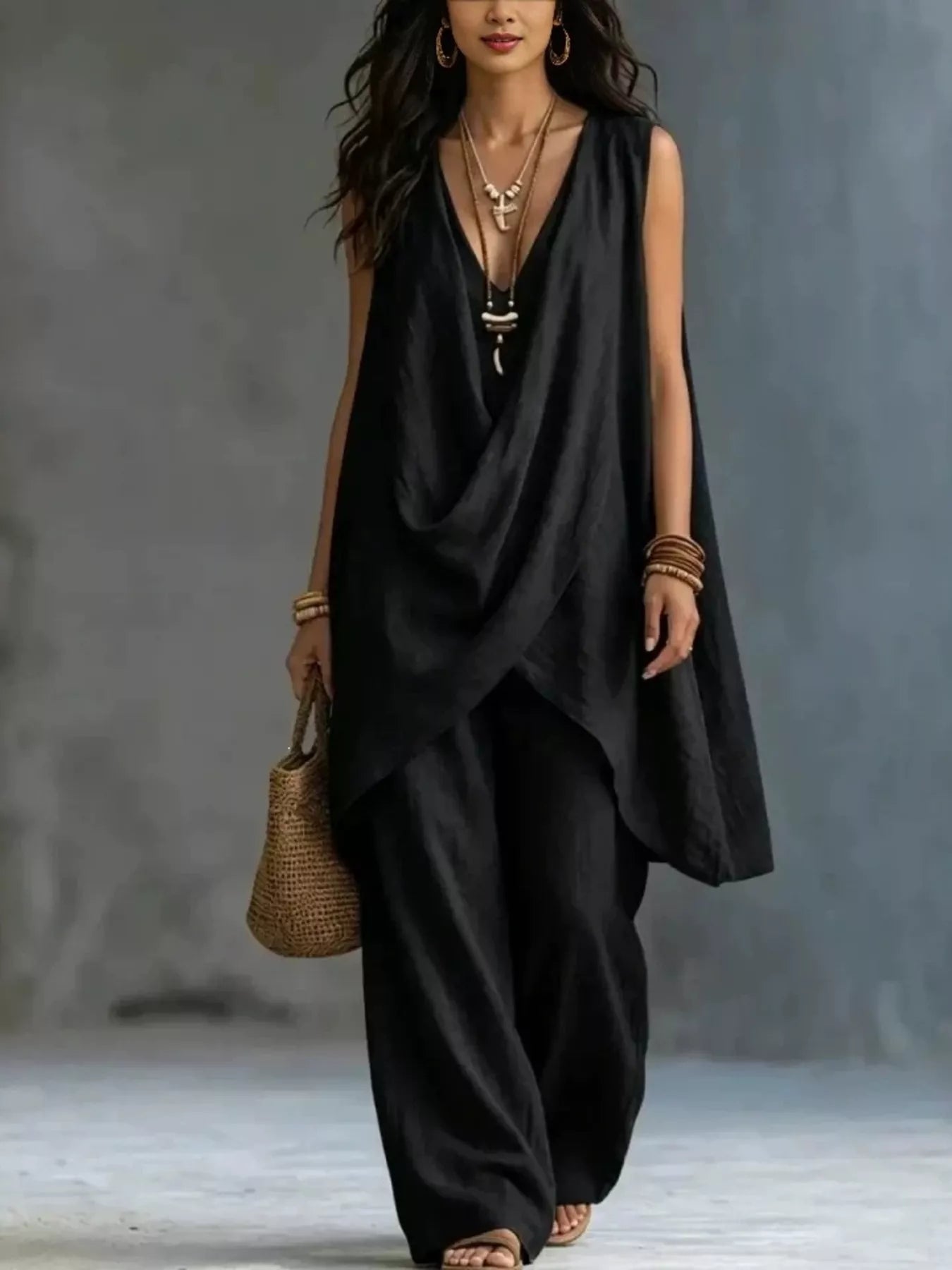 Plush Fashion Hub sleeveless asymmetrical top with wide-leg pants set, featuring stylish modern design and comfortable fit.