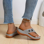 Women's trendy wedge sandals with toe post design from Trendsi, featuring comfortable summer footwear with stylish strappy details.