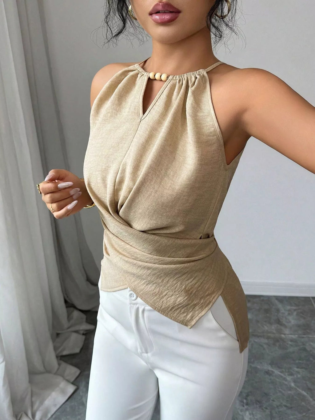 Plush Fashion Hub halter neck crisscross cami tank top in black, featuring a stylish halter design and sleek crisscross straps.