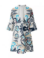 Bohemian print tiered mini dress by Shopimist featuring colorful patterns and flowing fabric, perfect for casual or summer wear.
