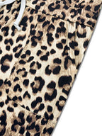 Leopard print one-shoulder top and matching pants set by Simply Love, featuring stylish animal print fabric and modern design.