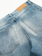 Men's loose fit jeans from Trendsi, casual denim pants with a relaxed fit, shown hanging on a hanger against a neutral background.