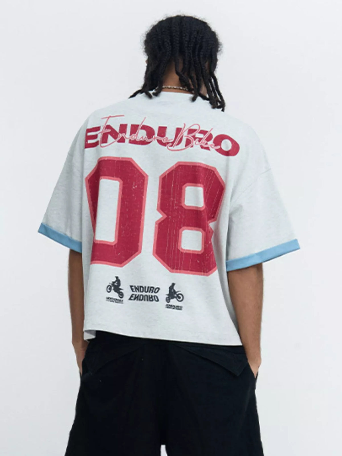 Men's graphic short sleeve T-shirt with contrast trim from Trendsi, featuring a bold graphic design and stylish trim detail.