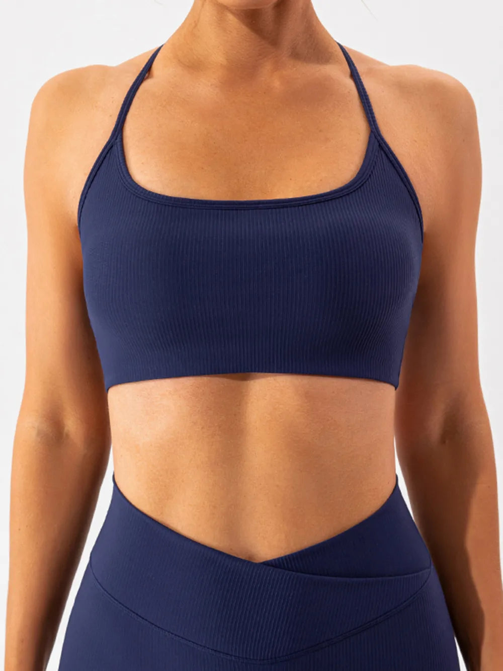 Trendsi Spaghetti Strap Active Bra in black, lightweight activewear with thin straps and supportive design for workout comfort.