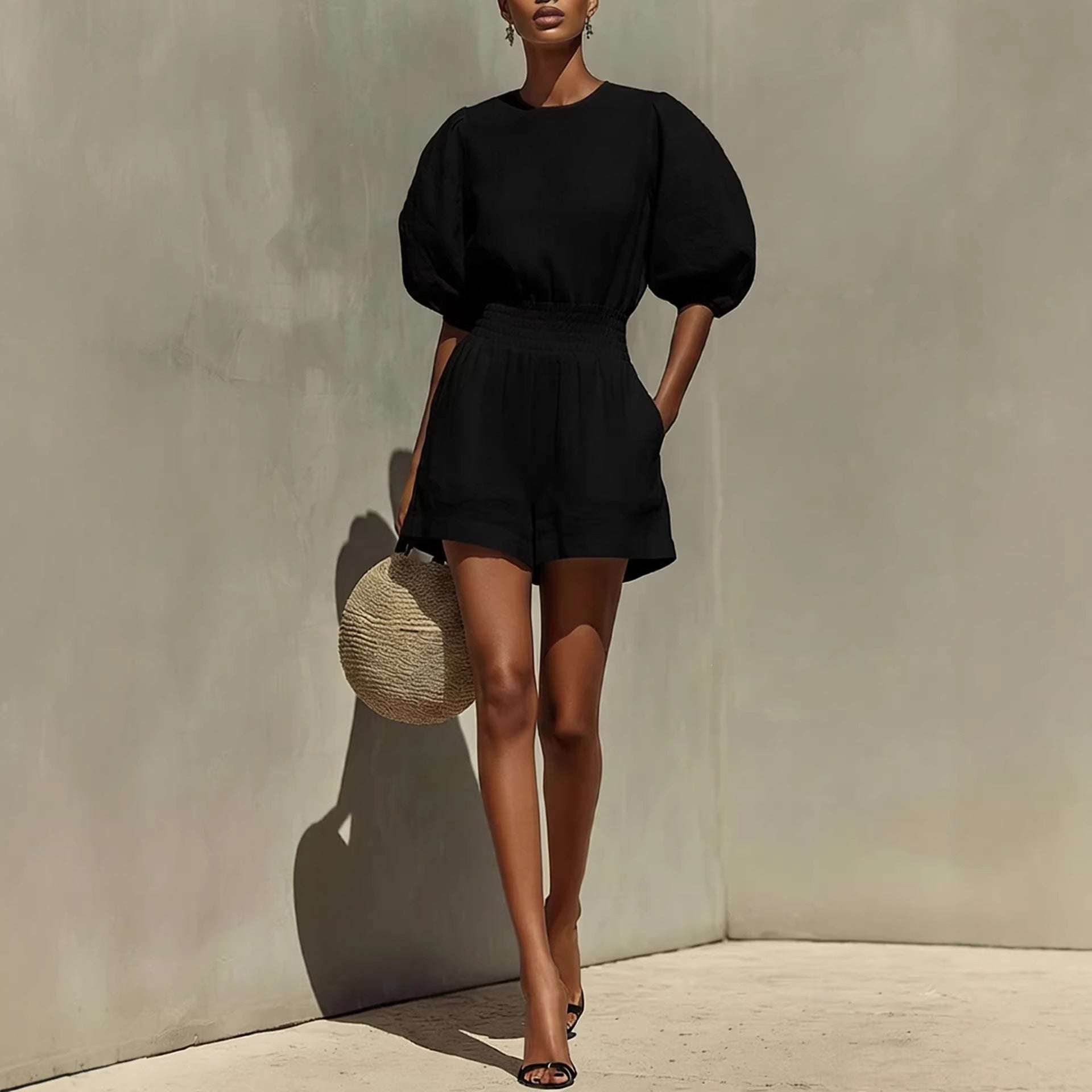 Women's puff-sleeve top and cropped shorts set by FitiqueFit, casual chic casualwear, shown on a model in a stylish outdoor setting.
