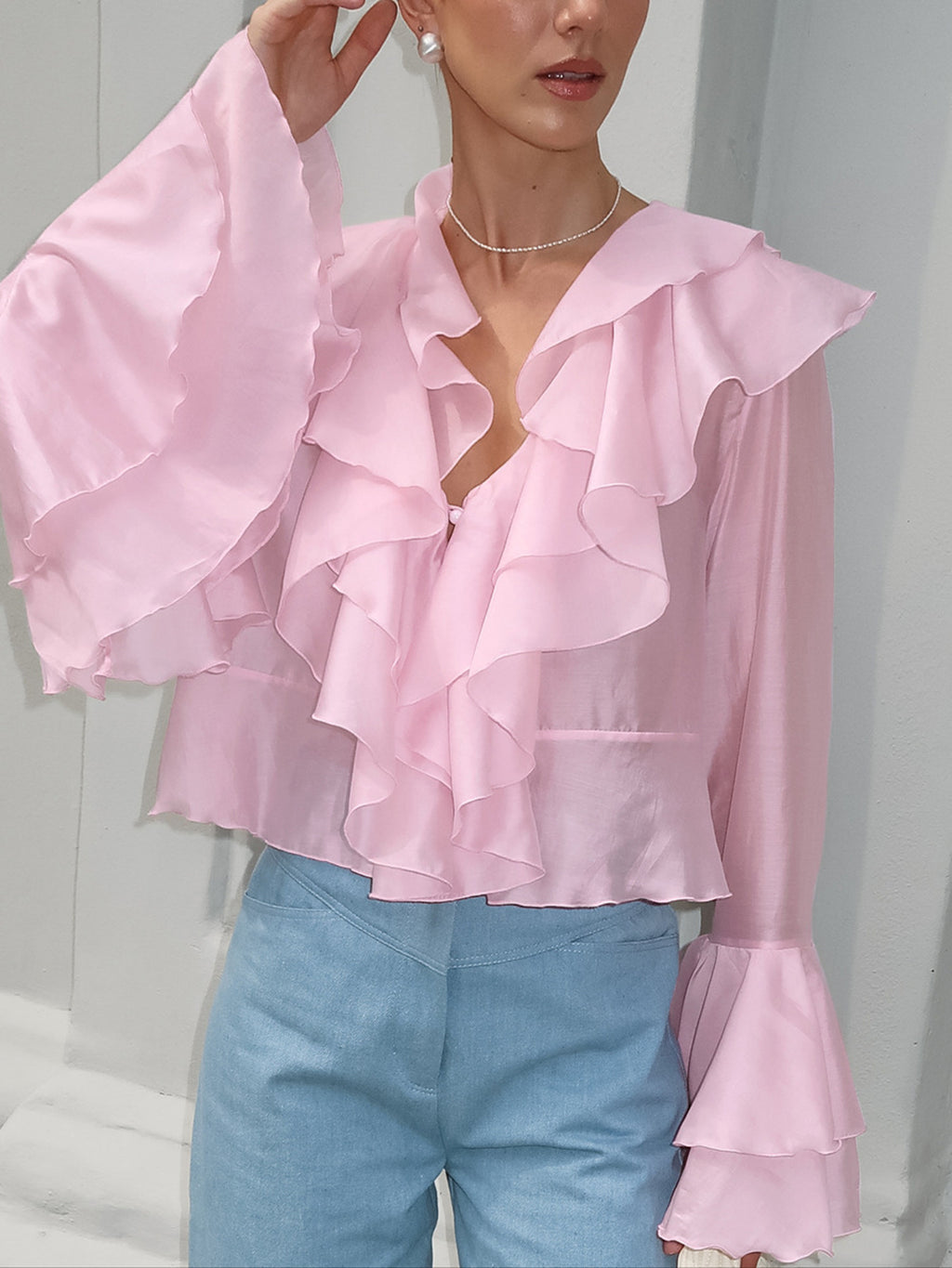 Women's elegant ruffle trim long sleeve blouse made from soft Tencel blend, featuring feminine details and a relaxed fit.
