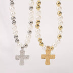Pearl and cross pendant necklace featuring a elegant pearl and metal cross charm, crafted by Shopimist.