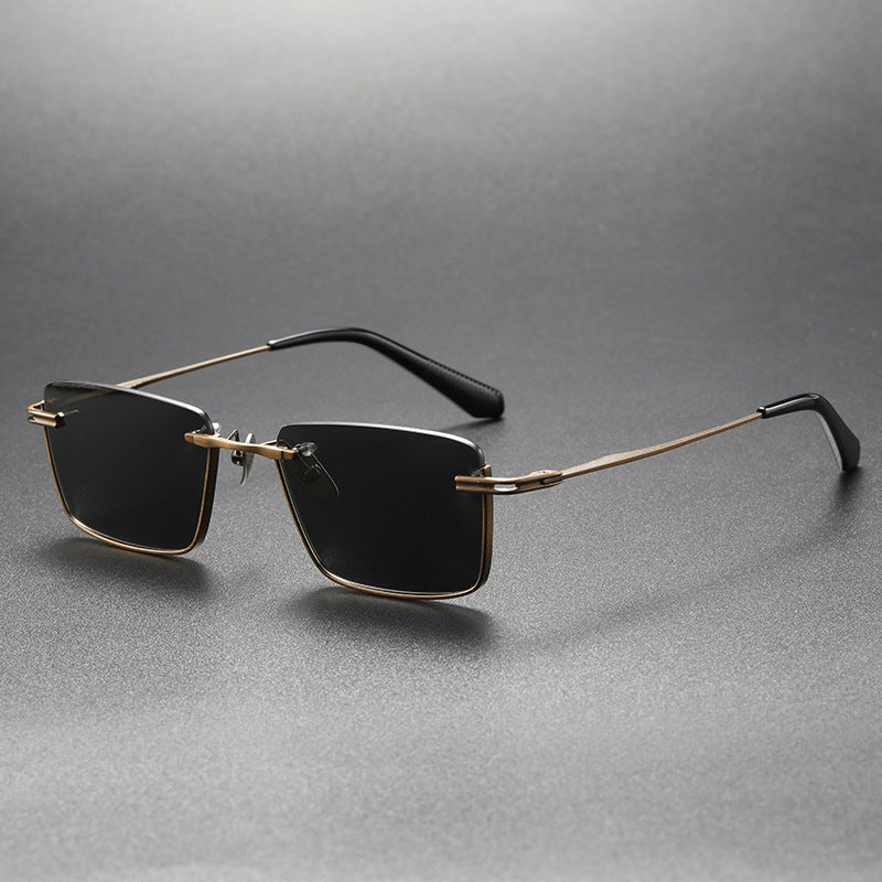 Pure titanium polarized sunglasses with retro British style, featuring sleek frames and dark lenses in the eyeWear collection.