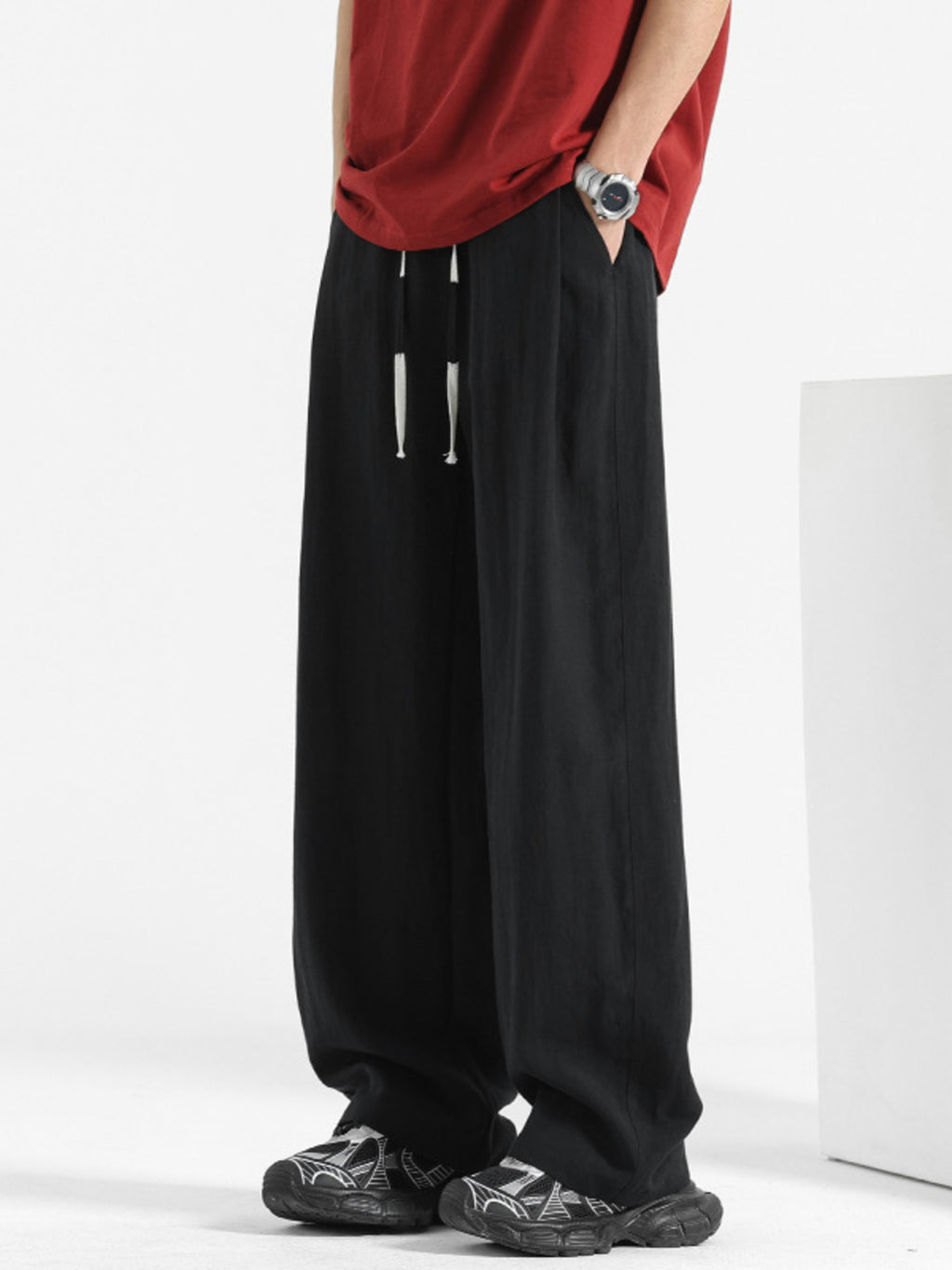 Men's casual loose fit pocket pants by Trendsi, featuring comfortable stretch fabric and relaxed fit design.