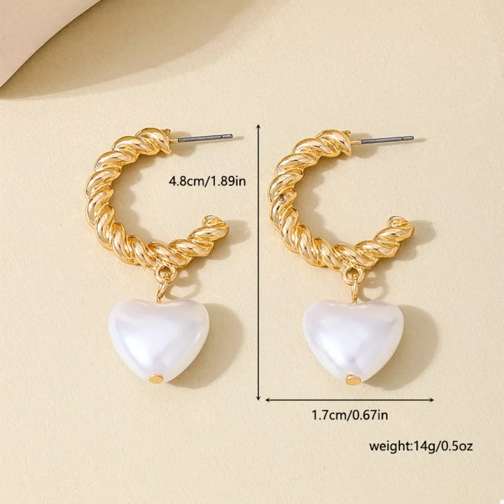 18K gold-plated C-hoop heart earrings with delicate heart charms, stylish jewelry accessory for women.