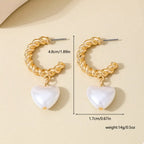 18K gold-plated C-hoop heart earrings with delicate heart charms, stylish jewelry accessory for women.