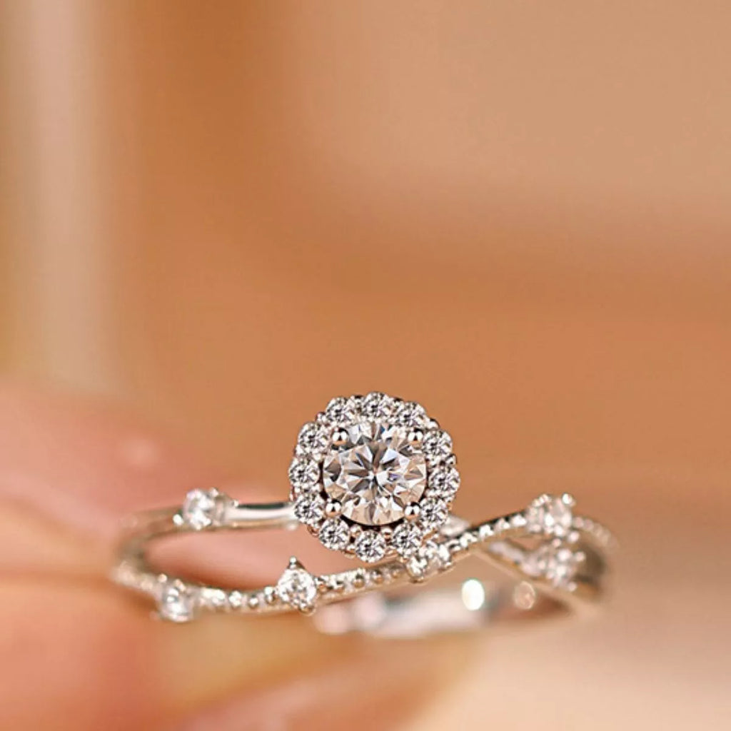 Sterling silver layered ring with a 1-carat moissanite gemstone, elegant design, shiny finish, from Shopimist.