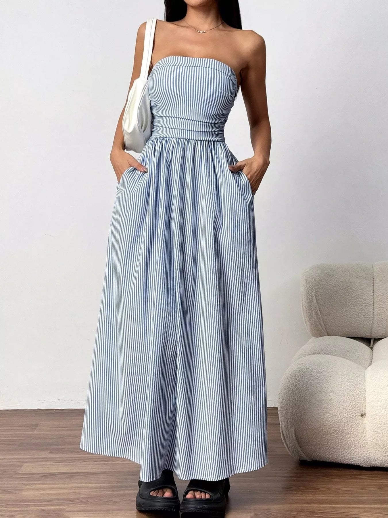 Striped strapless casual maxi dress by Plush Fashion Hub, flowing fabric with bold horizontal stripes and a relaxed fit.