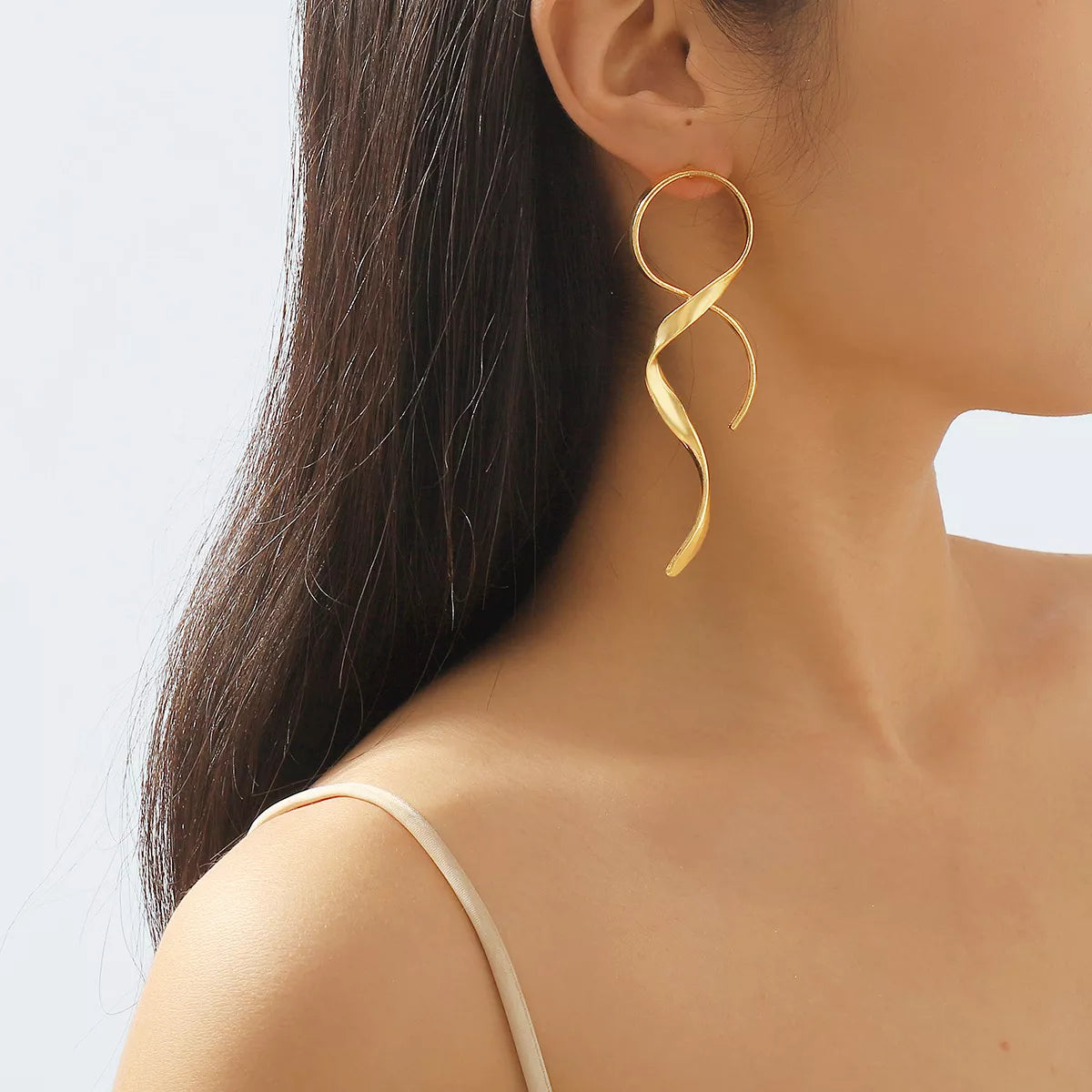 Plush Fashion Hub alloy spiral drop earrings with a sleek, modern design hanging against a neutral background.