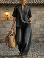 Plus size women's dress set with half sleeve top and wide leg pants by Trendsi, styled for a casual, comfortable look.