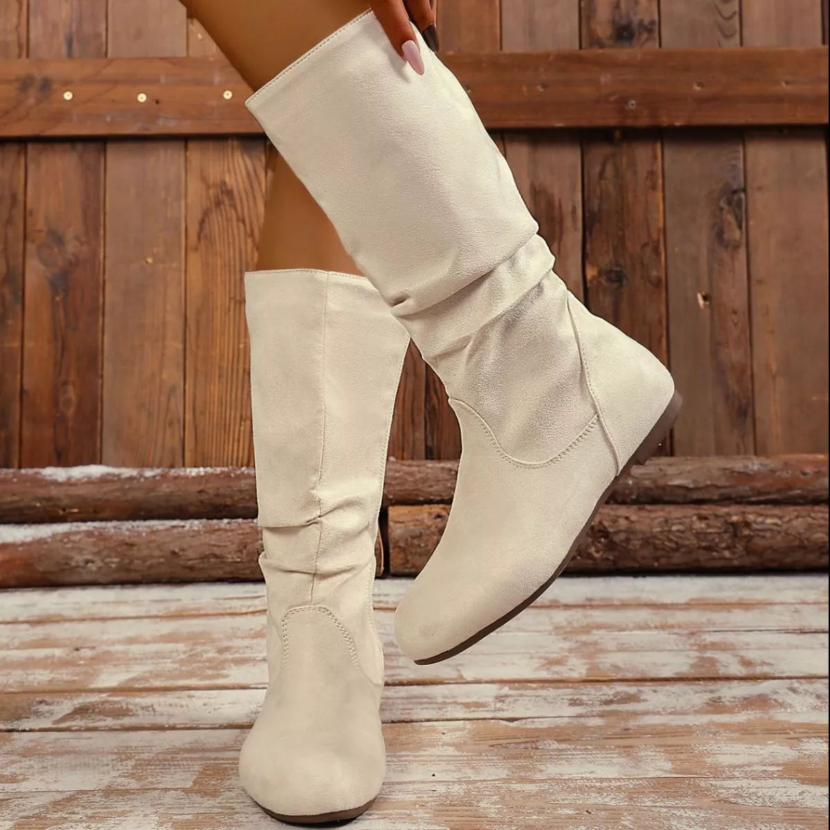 Round toe side zip boots by Trendsi featuring black leather material and stylish ankle-high design.