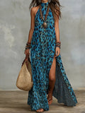 Women's printed boho maxi dress by FitiqueFit featuring sleeveless design, split front, loose fit, and vibrant pattern.