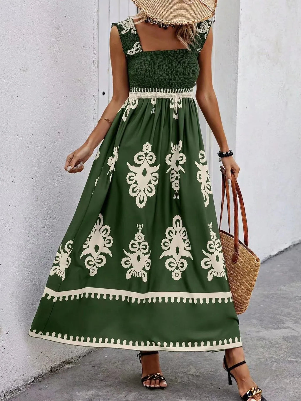 Smocked printed wide strap maxi dress by Plush Fashion Hub featuring a flowy silhouette and vibrant floral pattern.