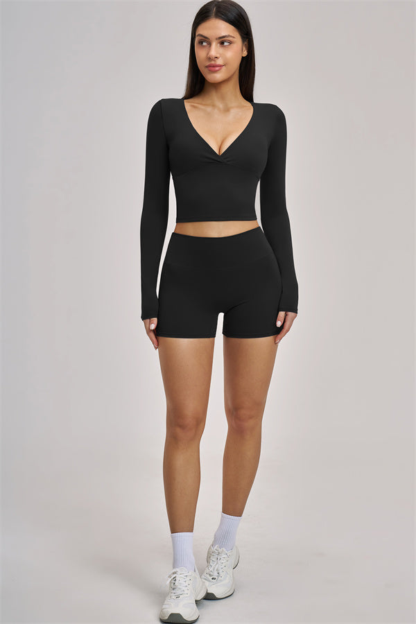 Fitglutes Activewear long sleeve crop top featuring a snug fit, soft fabric, and stylish design for workout and gym wear.
