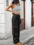 High-waisted cargo jeans by Plush Fashion Shop featuring durable denim fabric and multiple cargo pockets.