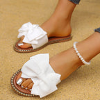 Shopimist Bowknot Embellished Flat Sandals featuring stylish bow accents and comfortable flat sole, perfect for casual summer wear.