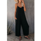 Women's pleated chest cross-strap jumpsuit by Plush Fashion Hub, featuring a stylish fitted waist and wide-leg design.
