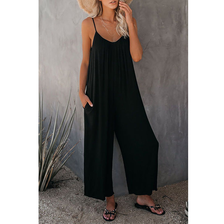 Women's pleated chest cross-strap jumpsuit by Plush Fashion Hub, featuring a stylish fitted waist and wide-leg design.