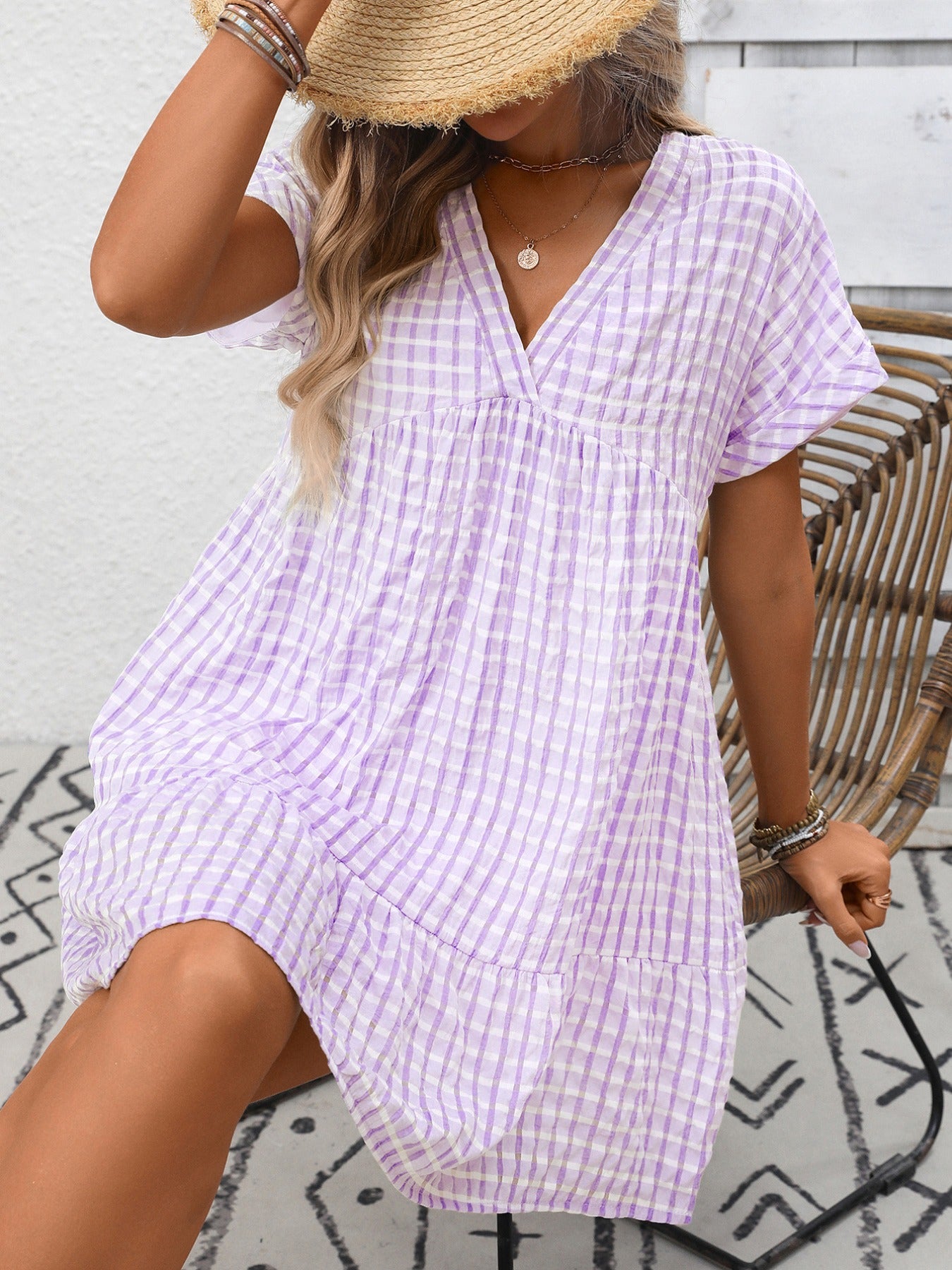 Plush Fashion Hub plaid v-neck mini dress with ruffle hem, lightweight seasonal fashion, featuring a chic plaid pattern and stylish design.