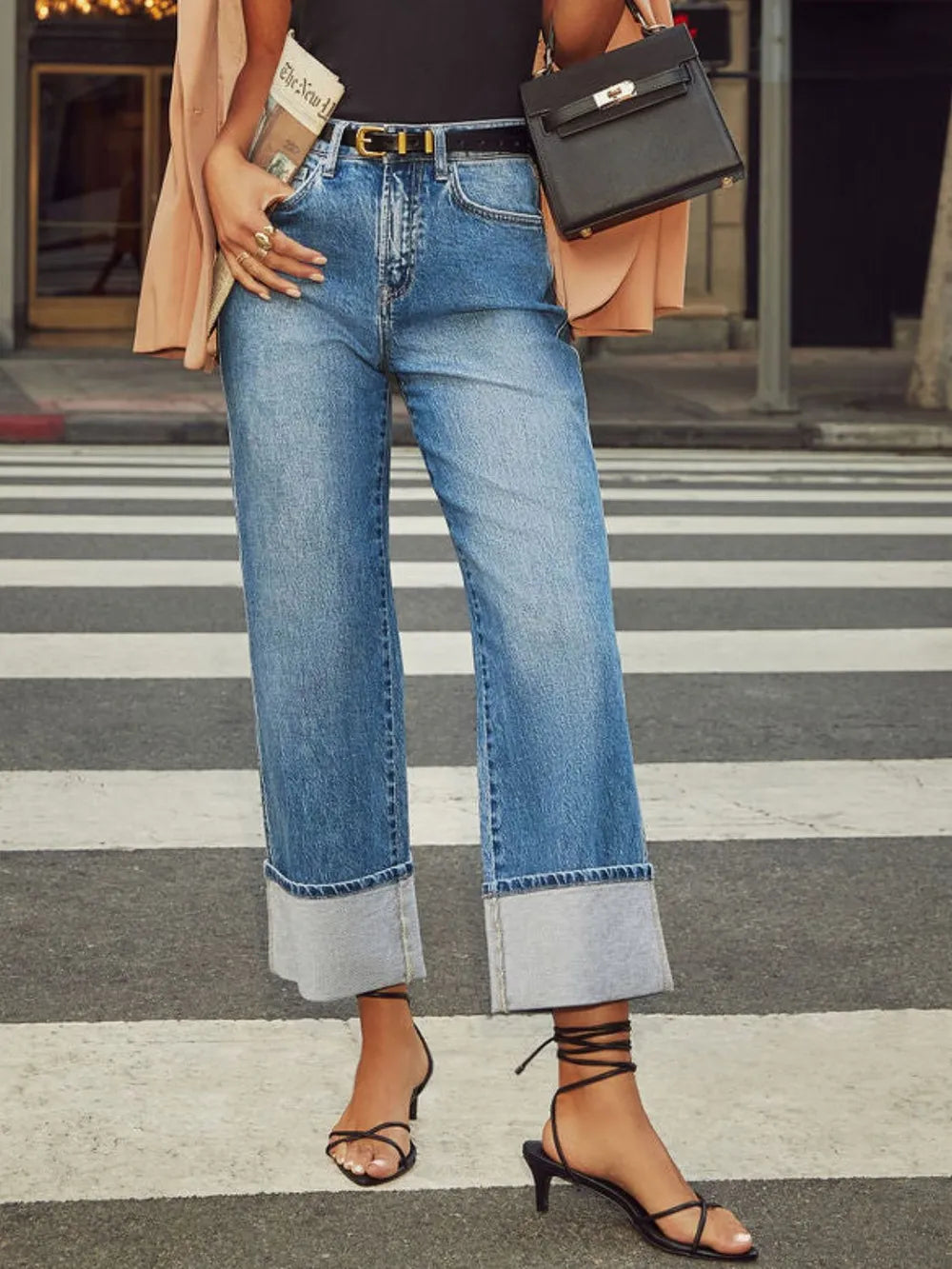 Trendsi high-waisted straight-leg rolled denim jeans showing classic blue denim fabric and casual fit on a model