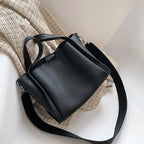 Plush Fashion Hub Kira Handbag in soft beige with gold hardware, featuring a sleek design and top handle for versatile style.