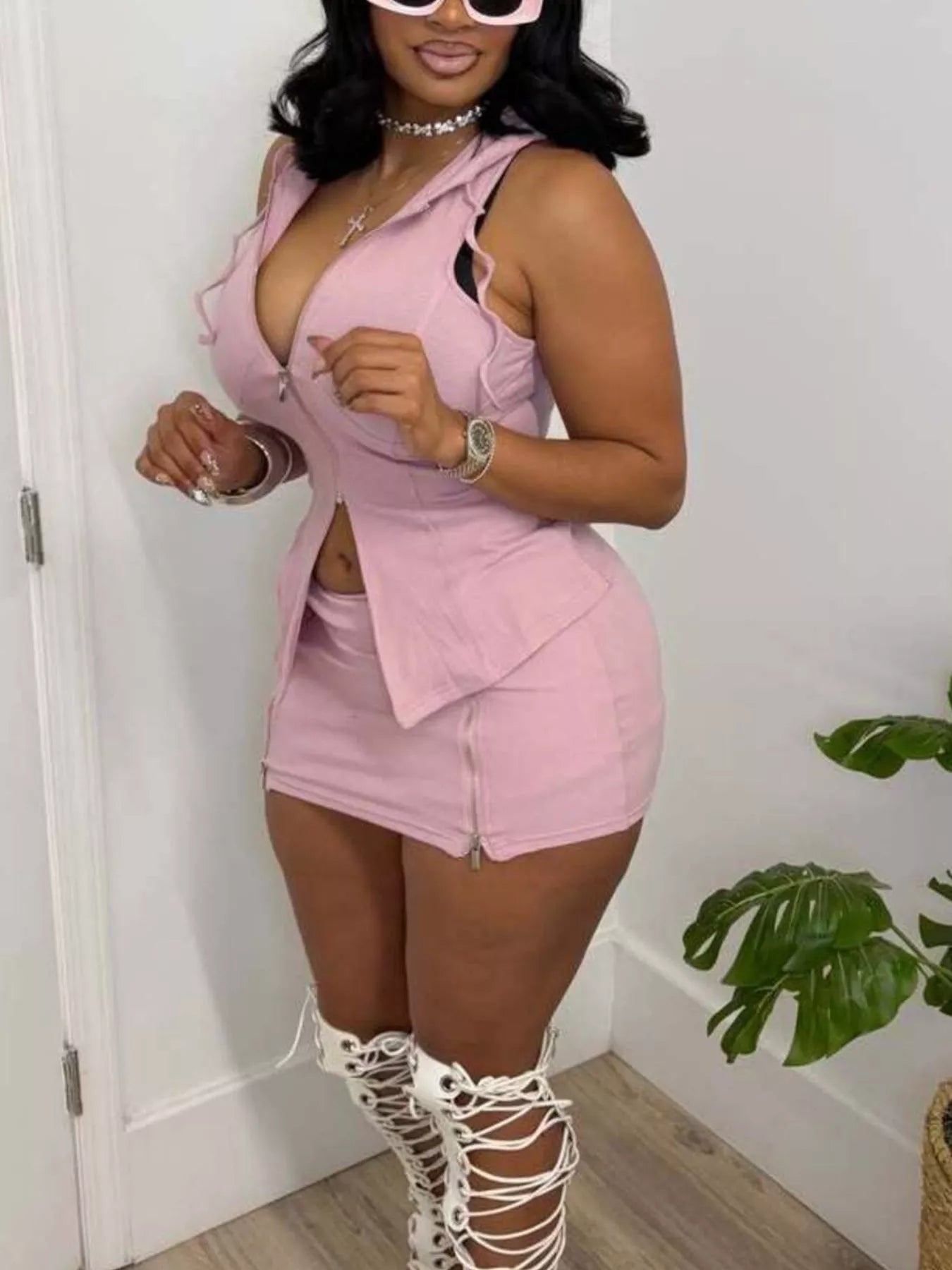 Hooded zippered sleeveless top and skirt set by Plush Fashion Hub, featuring a stylish two-piece outfit with a modern, casual design.
