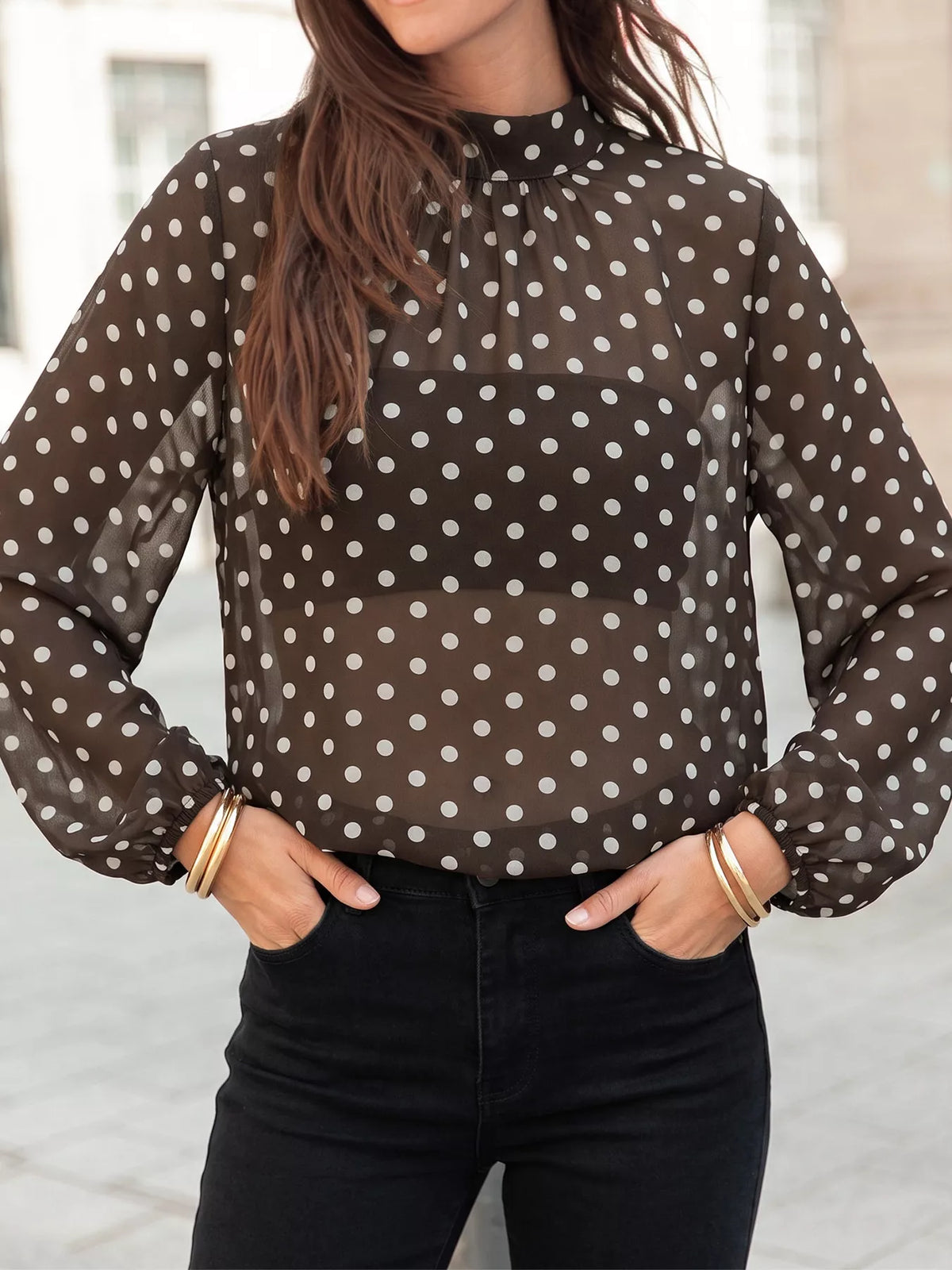 Polka dot mock neck long sleeve blouse by Trendsi featuring a stylish design and classic fit, perfect for casual or office wear.