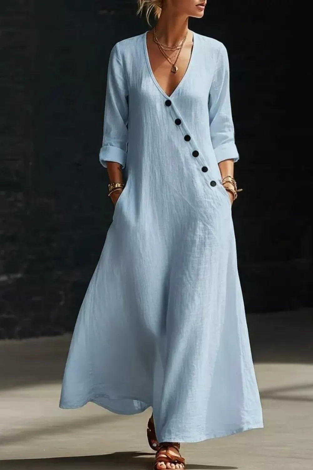 Long sleeve surplice maxi dress by Trendsi featuring a flowing design and elegant neckline, perfect for formal or casual occasions.