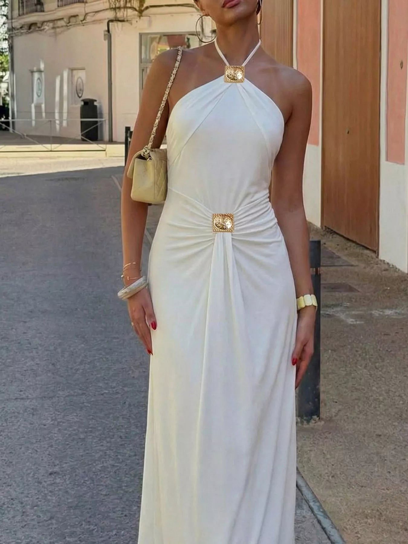 Plush Fashion Hub backless maxi dress featuring ruched halter neck in soft, flowing fabric with a stylish, elegant design.