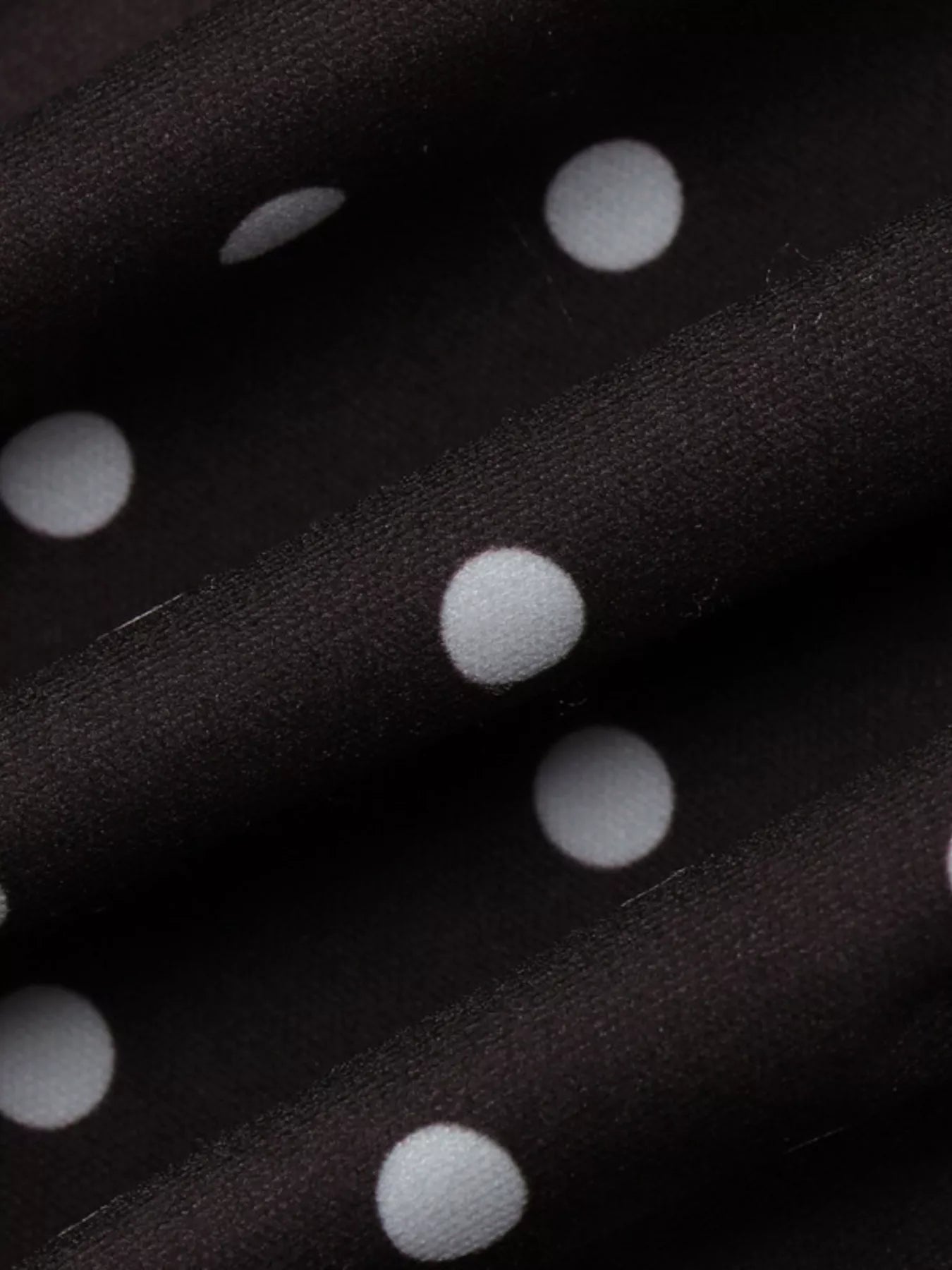 Polka dot cut-out front mini dress by Shopimist featuring a playful polka dot pattern and stylish cut-out design.