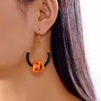 Gold-plated Halloween bead earrings with orange and black beads, stylish dangle earrings from Shopimist.
